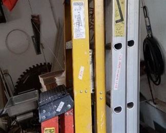 Ladders. Mill sawblades are in the background.