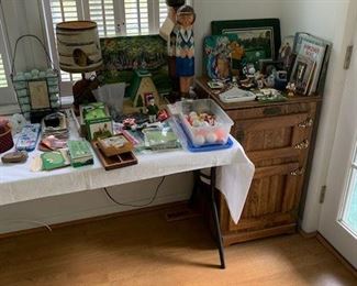 ... and still more golf. The oak piece is a contemporary "mini" refrigerator. Can't leave the TV golf game for a cool one.