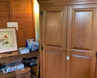 Maple armoire. Maple three drawer accessory piece. Collectible photo equipment in original boxes. Stack of three vintage "Bonwit Teller" hat boxes.