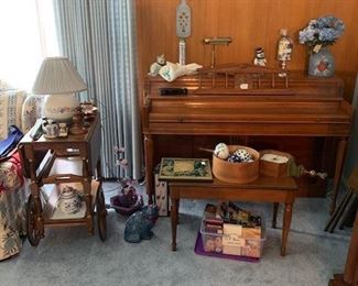 Piano. Tea cart with blue onion pattern accessories.