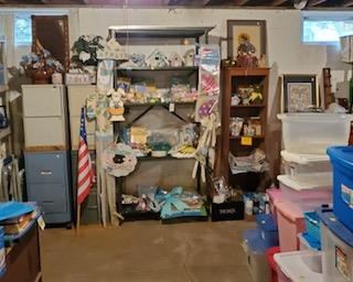 More - note stack of totes and there are more for sale in garage. In order to display everything we had to move many totes to garage. Still working there, will send photos when finished.