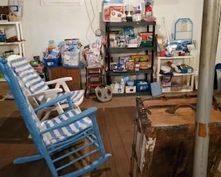 Think about sitting in one of these very comfortable chairs, one a rocker and one a folding. Lots of new household products. Antique flat top wood trunk.