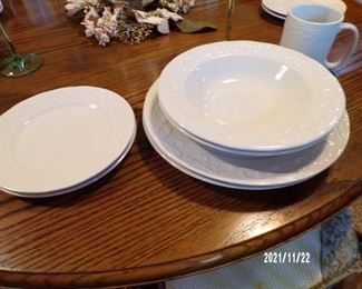 several sets of nice dinnerware
