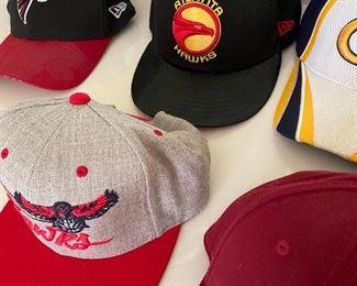 Selection of New Era & Mitchell embroidered hats for NBA, NCAA & NFL