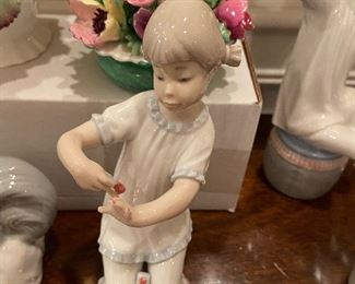 Retired Lladro girl manicuring her nails #1082