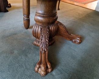 carved feet base of oak table