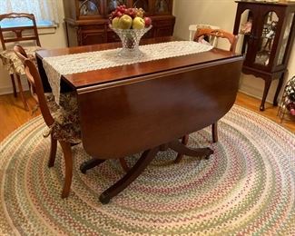 8 Dropleaf dining room table and 4 chairs