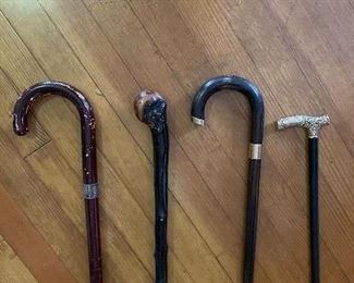 Various canes. Left to right: cane/silver fittings, shillelagh, cane/14k fittings, Vict. Gold headed cane, engraved