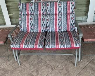 Southwest style cushions on metal glider