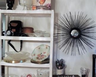 Brass starburst wall decor (current) - Entertaining: beverage containers, ice buckets, bowls and platters, cake plate, digital camera, and silver plate flatware