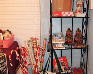 Narrow metal shelf, craft supplies and Christmas items, baskets. Craft kids