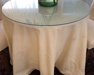 $175.00. Heavy duty table round with solid wooden top, custom made cream cotton table skirt, custom cut 1/4” thick pencil edged glass top; 30” high by 36” in diameter 