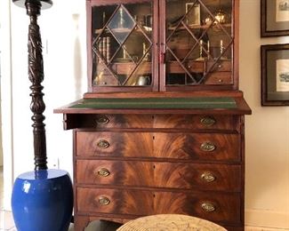 $1,800.00. Hepplewhite inlaid mahogany two-part secretary desk with arcaded cornice, mullioned glass doors, fold down writing board French feet.  Original brass pulls featuring an eagle in flight. Late 18th or early 19th century. 72” high by 40” wide by 20” deep when closed and 28 1/2” deep with fold out writing board opened. 