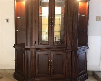 $ 350.00  Three piece Hooker lit display cabinet with glass shelves over closed storage. From Hurwitz-Mintz. Excellent condition.  72” wide by 24” deep by 77” high. Can be rearranged into one center case and a pair of corner cabinets!
