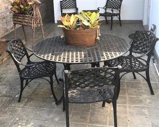 $ 450.00  Heavy cast outdoor set includes six arm chairs, dining table and side table. 