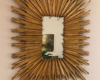 $600.00.  Fabulous oversized well made designer sunburst mirror with antiqued mirror glass. 49” high by 39” wide.  