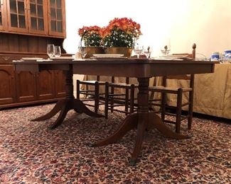 $2,400.00.  CLORE double pedestal dining table; SOLID walnut; 60” long by 46” wide by 29” high; comes with (4) 12” wide leaves to make a maximum length of 108”; apron plus tabletop measure 4” high