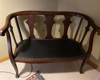 Antique settee with leather studded seat