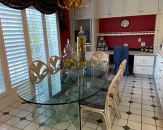 Oval glass top w/“V” glass bases dining table. $500