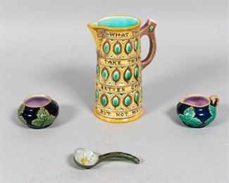52	Collection of Majolica	4 pieces of majolica. A Victorian Wedgwood ale mug with inscription bands on a yellow ground with a turquoise interior. Impressed Wedgwood mark and number 638 on the underside. 6 3/4" H x 3" Diameter. Matching creamer and sugar jar with dark blue ground and purple interior, comes with flower sugar scoop. Jar: 2" Diameter. Scoop: 3 1/4" Length. From the collection of the Salmagundi Club.
