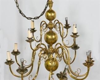 68	Brass Chandelier	12 light brass chandelier. 4 lights over 8 lights. Plastic candle holders cracked and missing. 35"L. From the collection of the Salmagundi Club.

