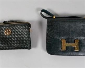72	2 Black Shoulder Bags	2 Black shoulder bag. A Tory Burch accordion leather bag with detachable shoulder strap and clutch strap. An Italian exotic leather bag with large gold H shaped clasp. Largest: 9" L x 7" W. From the collection of the Salmagundi Club.
