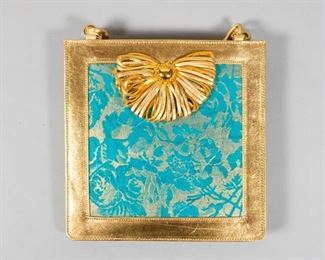 76	Emanuel Ungaro Turquoise Damask Handbag	An Emanuel Ungaro turquoise and gold damask handbag with gold strap and original retail tag. 8" L x 8" W. From the collection of the Salmagundi Club.
