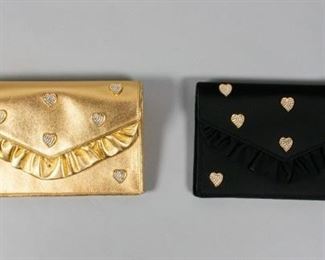 80	2 Sepcoeur Paris Clutches	2 Sepcoeur Paris clutches. In gold and black satin with bejeweled hearts with ruffle front panel. 8 1/2" L x 6" W. From the collection of the Salmagundi Club.
