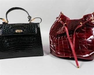 81	2 Crocodile Bags	A red leather bucket bag with gold tone hardware and tie clasp. A Franco Parmeggiani Crocodile skin bag with lock, gold tone hardware and detachable strap. Largest: 12" L x 10 3/4" W. From the collection of the Salmagundi Club.
