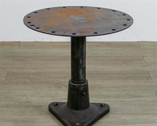 235	Industrial Metal Side Table	Industrial metal side table. 20 3/4" H X 21" Diameter
