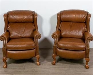 239	Pair of Presidential Leather Recliners	Pair of presidential leather recliners by Bradington Young. American, 20th Century. Ball & claw feet, wing back, leather upholstery and brass nail trim on arms and base. Some scuffs to feet and leather. 42" H x 34" L x 37" D

