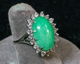 268	14K White Gold Jadeite and Diamond Ring	White gold ring marked 14kt with jadeite center stone surrounded by 20 round diamonds, size: 6 3/4, 7.2 grams with stones
