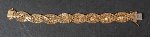 276	Braided 18k Gold Bracelet	Woven 18k gold chain bracelet. Stamped 750 on the clasp. 8"L, 61.2 grams
