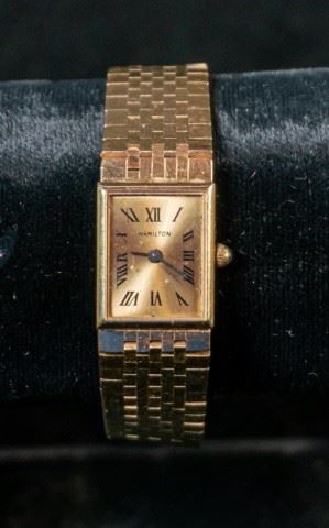 275	14K Yellow Gold B&M Hamilton Watch	14K yellow gold Baum and Mercier Hamilton ladies watch, scratches to crystal, marks consistent with age and wear, working condition not known, 33.3 grams

