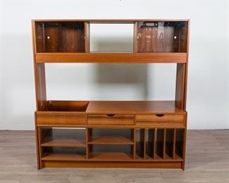 280	Rosewood Swedish Modern Adjustable Wall Unit	Rosewood Swedish modern wall unit. Three sections with ability to lengthen or shorten the unit. Overall: 60" H X 74 1/2" L X 19 3/4" D. Shortened: 60" H X 59 1/4" L X 19 3/4" D.
