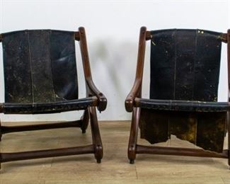 284	Pair of Don S. Shoemaker Sling Sloucher Chairs	Don S Shoemaker (Nebraska 1919-1990) Pair of Mexican Mid Century Modern Sling Sloucher Chairs. Cocobolo wood and leather. Manufactured by Senal S.A. in Mexico. Underside of chairs have paper label with designers and manufacturers information. Leather torn in half in one chair. Leather severely worn in other chair. Minor nicks to wood. 27" x 23 1/4" x 26" "Roman and Williams Buildings & Interiors Things We Made" Pages. 180-181
