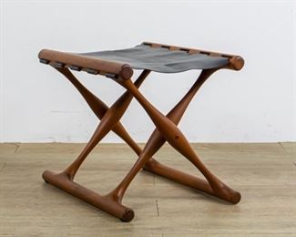 286	Poul Hundevad Gulghoj Folding Stool Danish Modern	Poul Hundevad (Denmark 1917-2011) Mid-Century Modern Gulghoj folding stool. Creases in leather from folding, minor surface wear to the wood. 15 1/2" x 14 1/2" x 19". "Roman and Williams Buildings & Interiors Things We Made" Page 180
