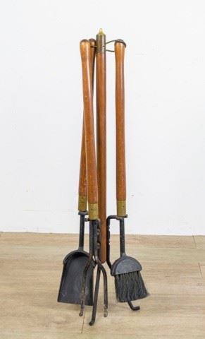 295	Danish Modern Fireplace Tools	Set of Danish Modern fireplace tools. Metal base with wooden pole, set consists of brush, shovel and poker, all with wooden handles. 38 1/2" H
