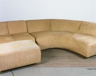 294	Mid Century Modern Sectional Sofa	Three piece mid century modern sectional sofa. Small tear, minor staining. Curved piece 28" x 95" (longest point to point) x 36". Straight piece 28" x 42" x 36". Ottoman 17" x 34" x 21"
