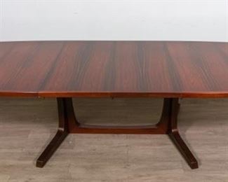 292	Niels Moller Danish Modern Dining Table	Niels Moller Danish Modern dining table. Danish, Mid 20th Century. Rosewood table with two removable leaves. Wear consistent with age. With leaves: 29" H x 114" L x 24" D Without leaves: 29" H x 75" L x 24" D
