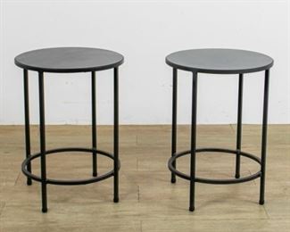 296	Pair of Black Metal Tables	Pair of black metal tables. 2 small scratches to surface on 1 table. 20 1/4" H X 15" Diameter
