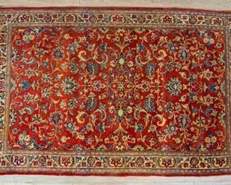 337	Oriental Rug	Oriental rug, wool. Floral - red, beige and blue. 6'9" x 4'3". Fringe appears to be cut down.
