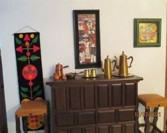 Bar like cabinet with sliding doors on back side.  Storage shelves and drawer.  