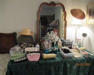 Dresser mirror.  Misc cosmetic bags, pillows, ladies hankies/men's hankerchiefs 