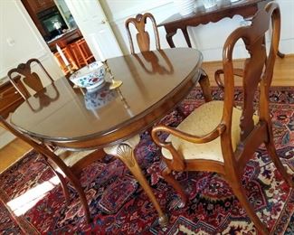 formal dining room set by Walter of Wabash, with 10 chairs, Table measures 67 1/2 " long and comes with two 22" leaves