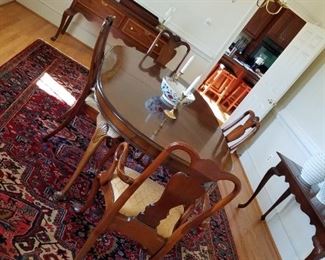 formal dining room set by Walter of Wabash, with 10 chairs. Table measures 67 1/2 " long and comes with two 22" leaves