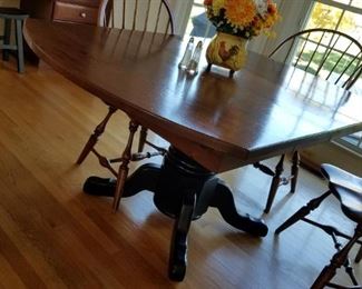 dining table by Amish. Measures 60" with one 12" leaf inserted.