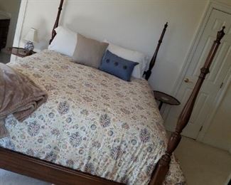 Bedroom #4: Queen 4 poster bed, 2 matching round tables, long chest, yellow cloth chair and older desk/table