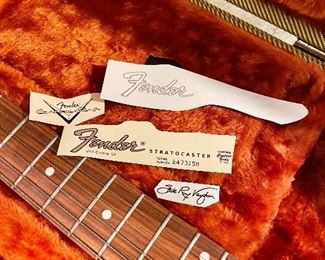 Fender with case & tags.