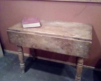 Old rustic drop leaf table